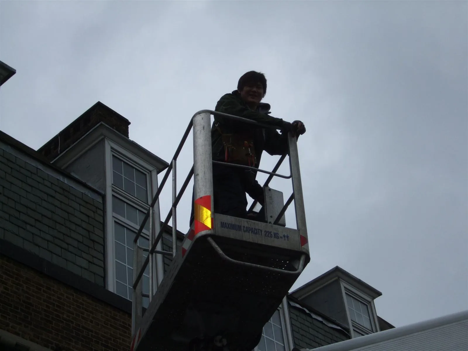 Electrician working from an elevated cherry picker