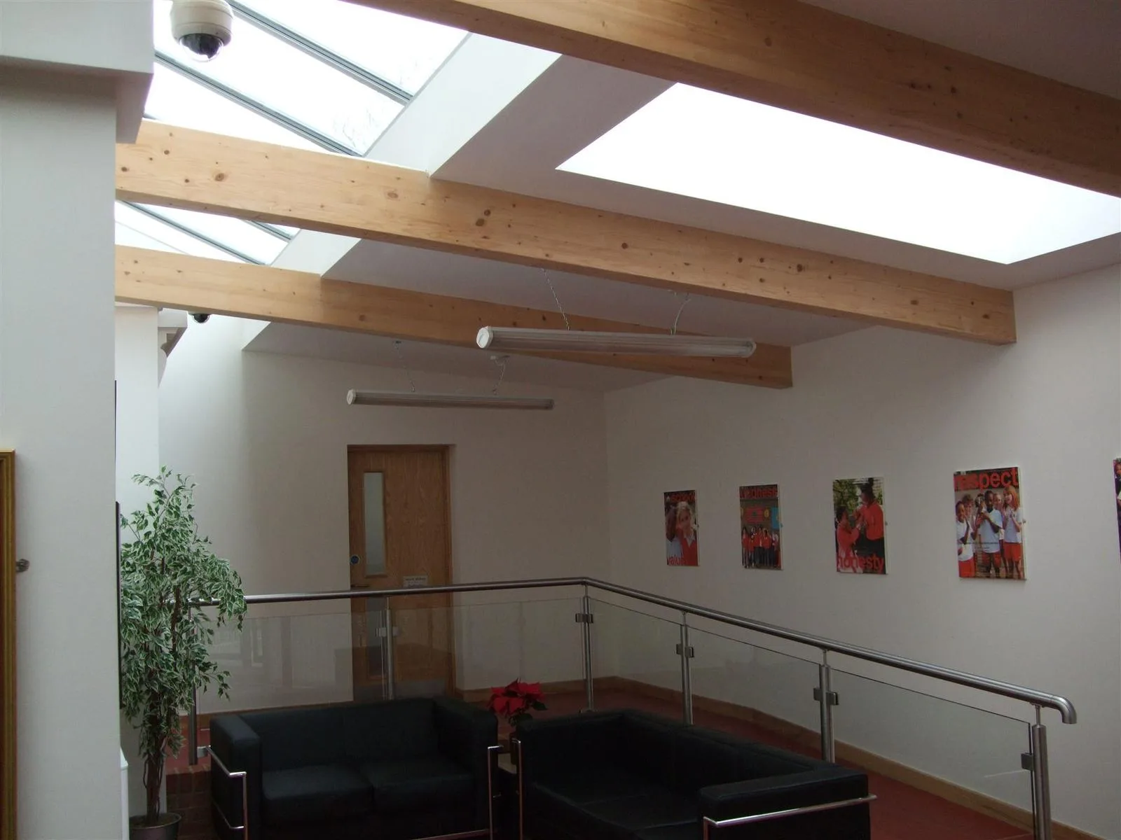CCTV dome camera installed in a school lobby ceiling
