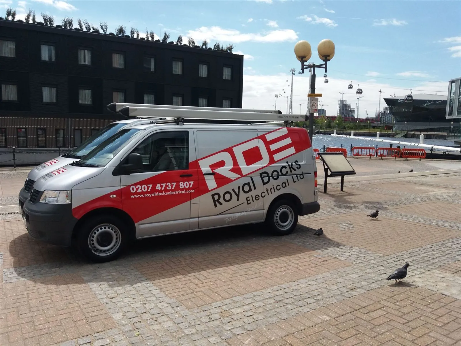 Royal Docks Electrical van on the Royal Docks waterfront