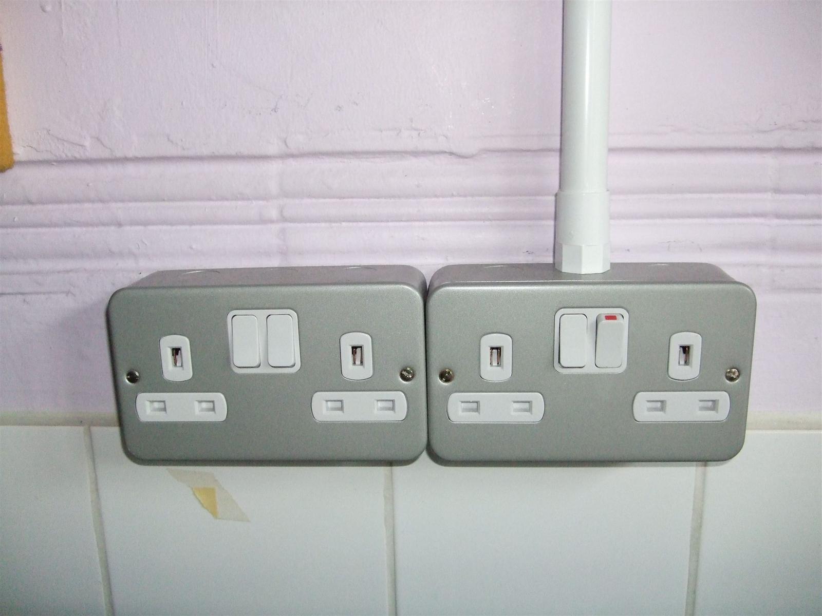 Metal-clad double sockets installed on a wall