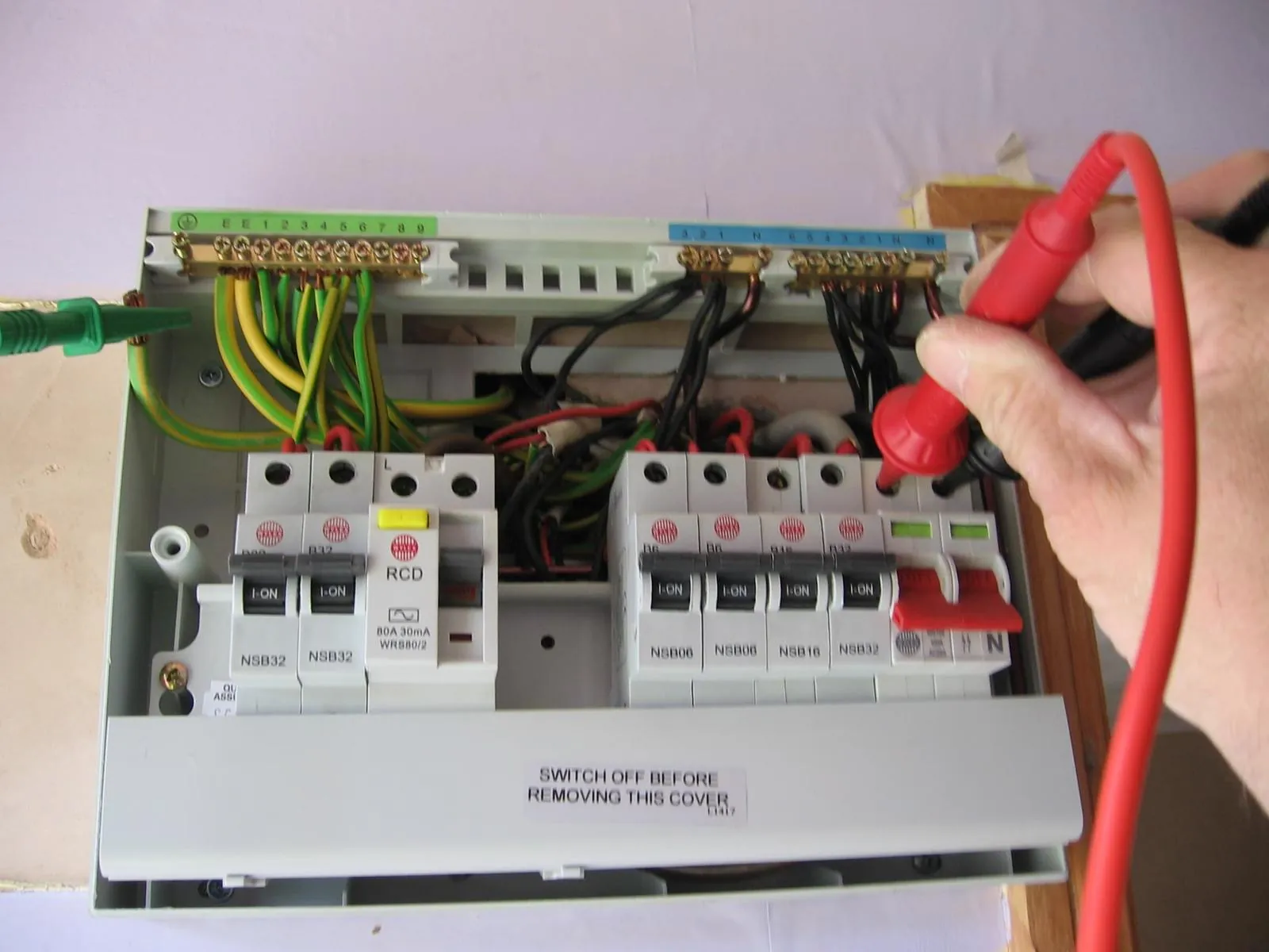 Consumer unit being tested during an EICR