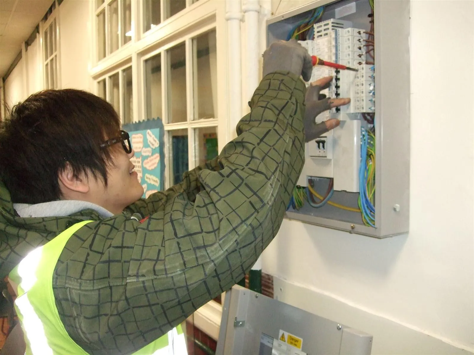 Electrician wiring a distribution board